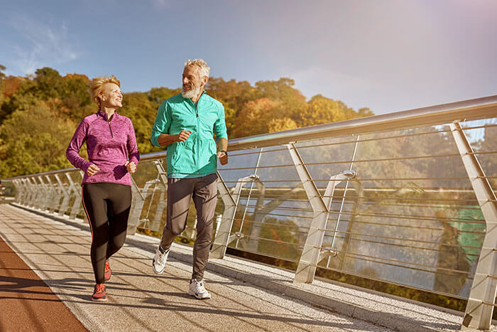 Couple Jogging on a Bridge